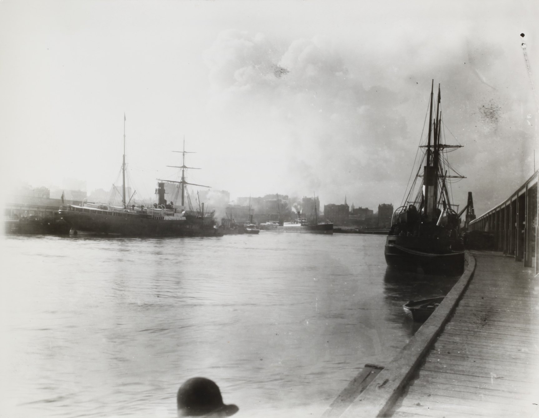 Black and white image depicting sailing ships and steam ships at Victoria Dock, circa 1905