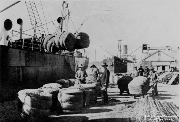 Loading bales of wool onto a ship, Queensland, about 1910